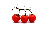 Three ripe red tomatoes on a light background. Natural product.