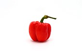 One red ripe bell pepper on a light background. Natural product.