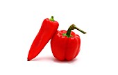 Two red ripe sweet peppers on a light background. Natural product