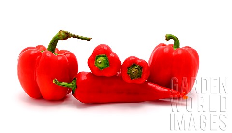 Several_red_ripe_sweet_peppers_of_different_shapes_on_a_light_background_Natural_product_Natural_col