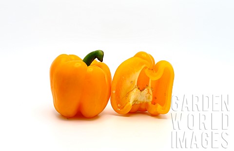 Sweet_yellow_pepper_whole_and_in_a_cut_on_a_light_background_Natural_product_Natural_color_Closeup