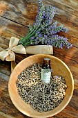 Lavender (Lavandula sp), flower bouquet, dried flowers and essential oil bottle, medicinal plant, benefits