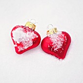 RED HEART BAUBLES IN THE SNOW