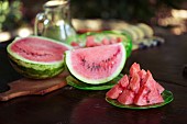 Watermelon, Citrulus lanatus, Outdoor shot of sliced fruit showing red flesh and seed,