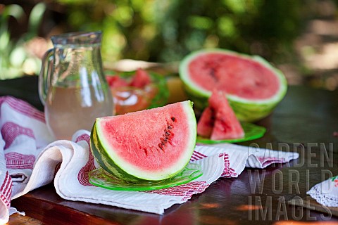 Watermelon_Citrulus_lanatus_Outdoor_shot_of_sliced_fruit_showing_red_flesh_and_seed
