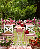 SUMMER TERRACE WITH RED AND PINK IMPATIENS