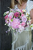 BOUQUET OF PINK PEONIES, GARDEN ROSES, RANUNCULUS AND SCABIOSA WITH GRASSES AND WILDFLOWERS
