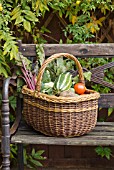 WICKER BASKET OF VEGETABLES CONTAINING MARROW, TOMATOES, CAULIFLOWER, BEETROOT AND POTATOES