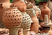 TERRACOTTA POTS AND JARS ON DISPLAY AT A MARKET STALL IN LEBANON