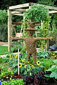 WICKER MAN IN VEGETABLE BORDER,  SUTTONS GROWING FOR HEALTH GARDEN AT TATTON PARK 2007 DESIGNED BY KEVIN AND SUZANNE DUNNE