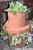 CHIMNEY POT PLANTED WITH PRIMULAS