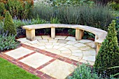PAVED AREA WITH CURVED WOODEN BENCH