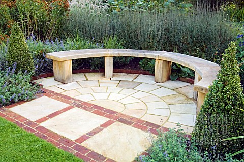 PAVED_AREA_WITH_CURVED_WOODEN_BENCH