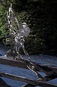Contemporary hand crafted mild or stainless steel sculpture of Angel sitting on gate