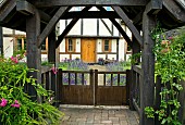Wooden Lych gate leading to front door
