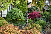 Semi formal garden with statue and fountain