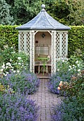 Circular summer house aromatic borders of lavender and roses