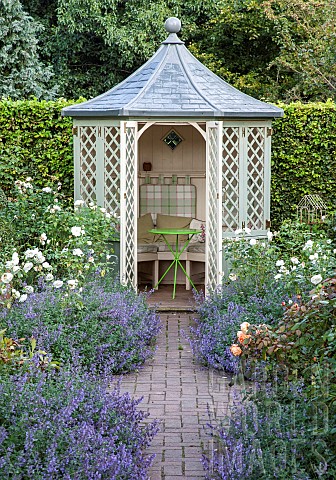 Circular_summer_house_aromatic_borders_of_lavender_and_roses