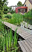 SWIMMING POND WITH WOODEN DECKING AREA