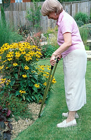 LADY_TRIMMING_LAWN_EDGE_WITH_LONG_HANDLED_FLAT_EDGING_SHEARSMODEL_RELEASED